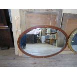 An Edwardian oval mirror