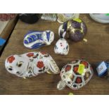 Five Royal Crown Derby porcelain paperweights, four with stoppers