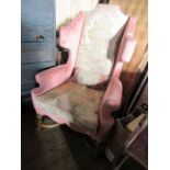 An 18th Century design wingback armchair.