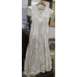A silk dress and a lace veil