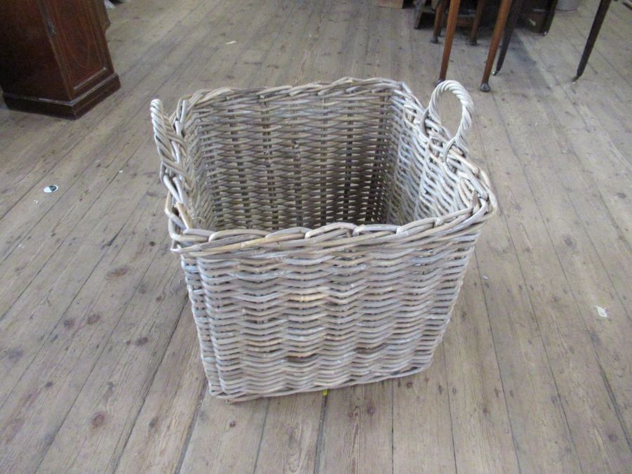 A square wicker basket, 25ins x 24ins, height excluding handles 23ins