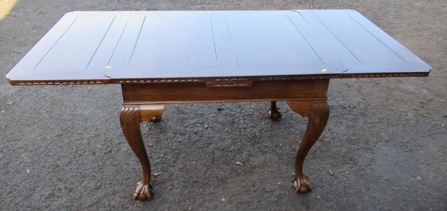 A draw leaf dining table, 70ins x 35ins, height 30ins