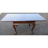 A draw leaf dining table, 70ins x 35ins, height 30ins