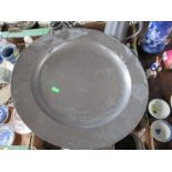 A large pewter serving dish, diameter 18ins together with other pewter and metalware