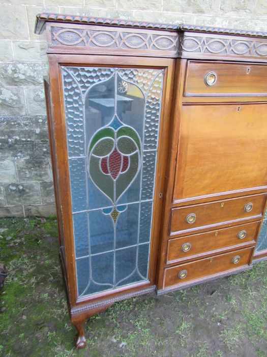 A mahogany cabinet, having central drawers flaked by glazed stained doors, width 57ins, height - Image 2 of 3