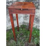 A 19th Century mahogany square topped kettle stand, fitted with a slide, height 28ins