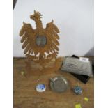 A carved wooden double headed eagle, set with a plaque, having easel support, together with a box,