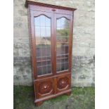 An oak glazed display cabinet,  width 37.5ins, height 76ins, depth 11ins