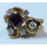 A 14k garnet and diamond dress ring, 13.1g