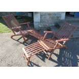 A pair of steamer style wooden garden chairs