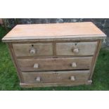 An Antique pine chest, of two short drawers over two long drawers, lacking back panels, 42.5ins x