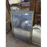 A gilt framed mirror