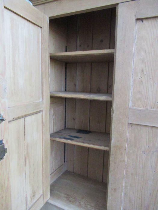 A pine double cupboard, having two pairs of fielded cupboard doors opening to reveal adjustable - Image 3 of 3