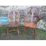 An Antique yew Windsor armchair together with a single Windsor chair