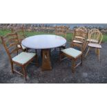 An Ercol gate leg table, together with 4 ladder backed Ercol chairs and 4 kitchen chairs