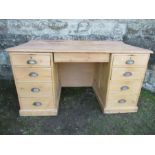 A GWR pine desk, the handles and base both stamped GWR  , width 59ins,  depth 31ins, height 31ins