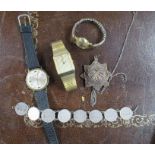 A Talis wrist watch, together with two other wrist watches, a silver filigree star pendant on