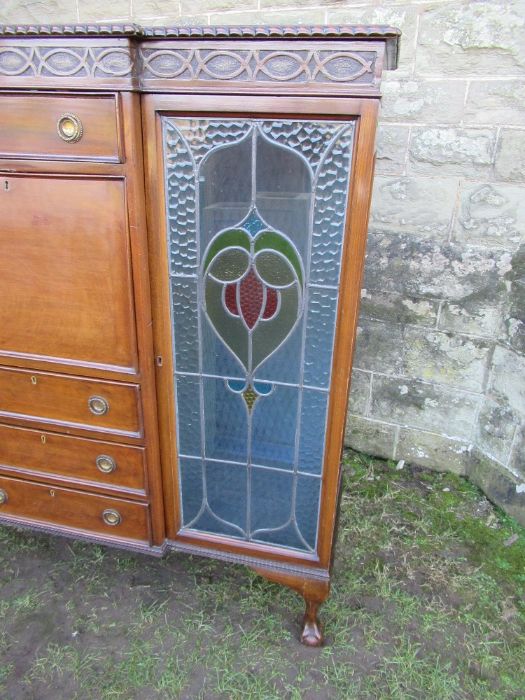 A mahogany cabinet, having central drawers flaked by glazed stained doors, width 57ins, height - Image 3 of 3