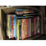 A shelf of  children's annuals, to include Hotspur, Lion Playhour and Rupert