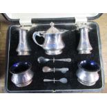 A cased hallmarked silver five piece condiment set, with spoons