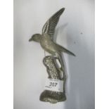 A metal car mascot, of a bird on a branch, height 7.5ins
