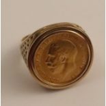 A 9ct gold ring, set with a George V 1913 gold half sovereign, with pierced trellis shoulders,