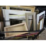 A large collection of frames, mounts, folio stands and easels.