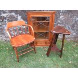 An Arts and Crafts style occasional table, together with an arm chair and a corner unit.