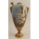 A Royal Worcester vase, decorated with six swans to a powder blue ground by C H C Baldwyn, the