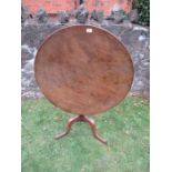 A 19th century mahogany tilt top tripod table, diameter 34ins