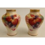 Two Royal Worcester vases, decorated with Autumnal leaves and berries by K Blake, shape number 2491