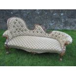 A Victorian chaise longue, with shaped button back