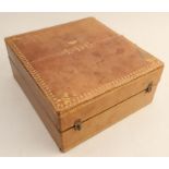 A leather travelling box of rectangular form with a raising lid monogrammed LDC under a coronet