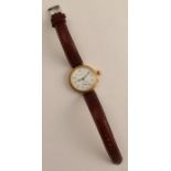 An 18ct gold cased Longines wrist watch, with circular white enamel dial, Arabic numerals and