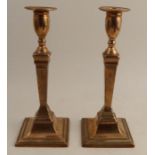 A pair of 18th century candlesticks, engraved Made of Spanish Cannon Destroyed at Gibraltar Sept