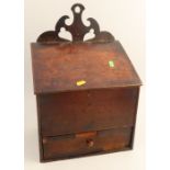 An Antique oak box, the sloping lid open to reveal two compartments and a drawer below, width 12.