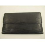 A Louis Vuitton black leather purse.