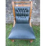 An Edwardian deep buttoned back easy chair