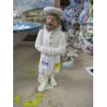 A Royal Worcester figure, of a Russian man after James Hadley, damaged