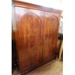 A 19th century mahogany double door wardrobe, fitting with a hanging space and drawers, height