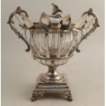 A French silver and glass confiturier, raised on a covered pedestal, having two handles and fitted