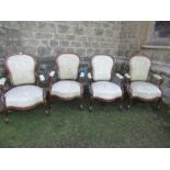 A set of four Victorian show wood open arm chairs