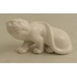 A Roya Worcester netsuke, modelled as white panther or a cheetah, height approx. 1.5ins - unglazed