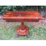 A 19th century rosewood fold over table, width 36ins, height 28ins  There are some marks and scuffs.