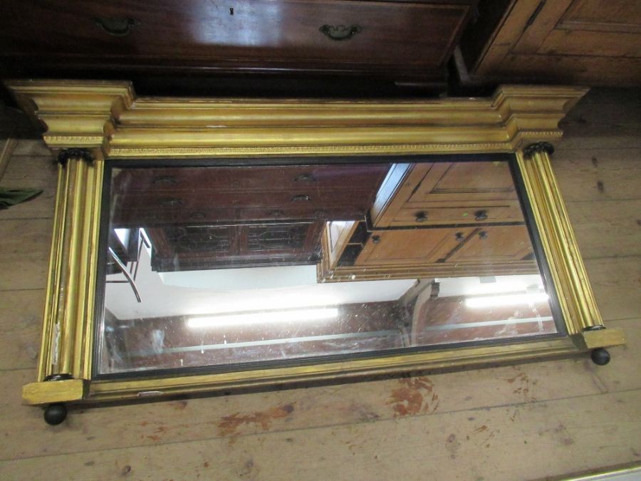 A Regency gilt frame over mantle mirror, width 56ins, height 28ins
