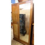 A mahogany mirror door wardrobe, height 75ins, width 40ins, depth 22ins