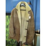 A three quarter length sheepskin coat