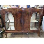 A walnut display cabinet, width 52ins, height 47ins