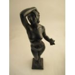 A bronze figure of Eve, nude holding apple and raised on a pedestal height, titled temptation 20ins