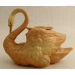 A Royal Worcester blush ivory centre piece, formed as a swan with a vase on its back, shape number